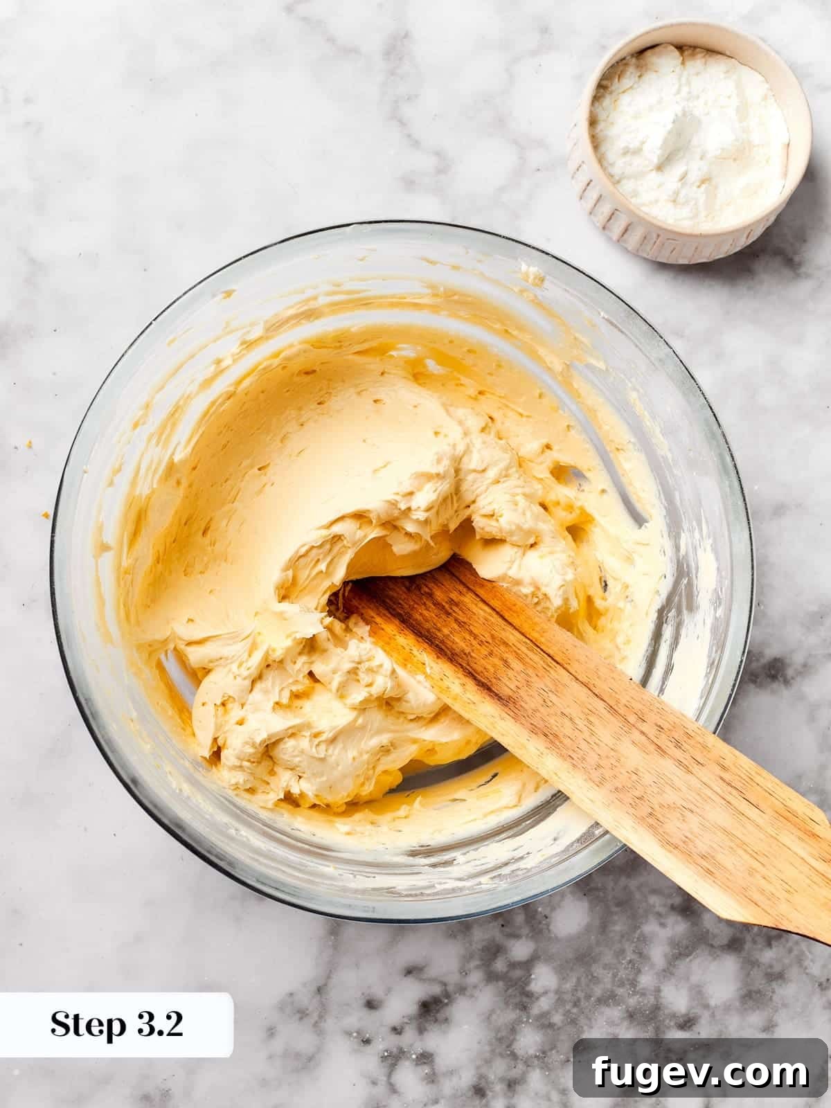 Easy Spritz Cookie Perfection 8 Butter being added to the mixing bowl to start the spritz cookie dough base.