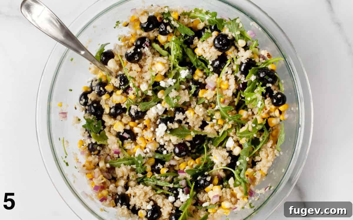 Golden Corn Blueberry Medley 6 A large bowl filled with blueberry corn salad, perfectly tossed with the lemon vinaigrette, ready to be served.