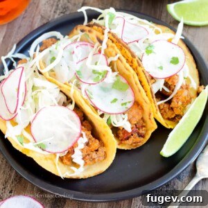 A close-up of a Chipotle Chorizo Taco with sweet potato tortilla and mezcal lime slaw, highlighting its vibrant ingredients.