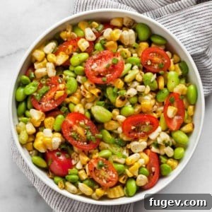 Grilled corn succotash with edamame in a bowl, a close-up.