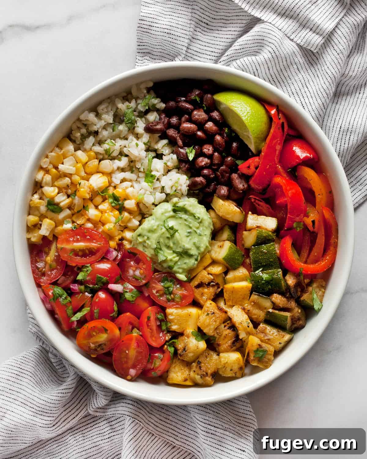 Grilled Garden Burrito Bowl 2 Easy grilled vegetarian burrito bowl with colorful peppers, zucchini, and squash, showcasing fresh ingredients.