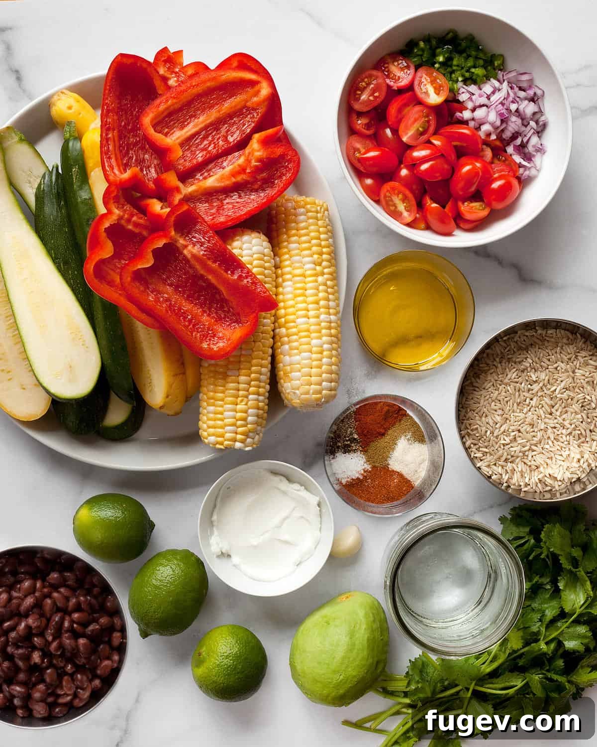 Grilled Garden Burrito Bowl 3 Fresh ingredients laid out for vegetarian burrito bowls, including zucchini, squash, bell peppers, corn, a variety of spices, fresh limes, cilantro, and rice.