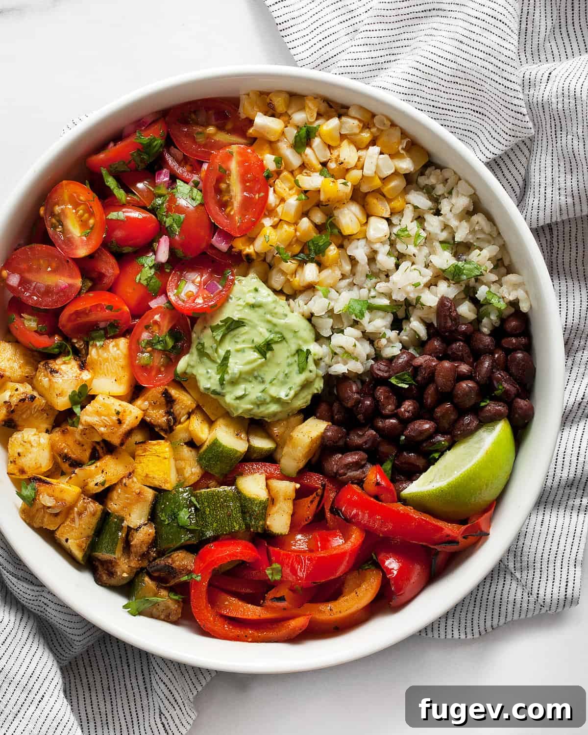 Grilled Garden Burrito Bowl 8 An exquisitely assembled grilled veggie burrito bowl, featuring colorful squash, zucchini, bell peppers, hearty black beans, and fresh pico de gallo, garnished with cilantro.