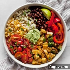 Assembled vegetarian burrito bowl with grilled veggies, black beans and pico de gallo.