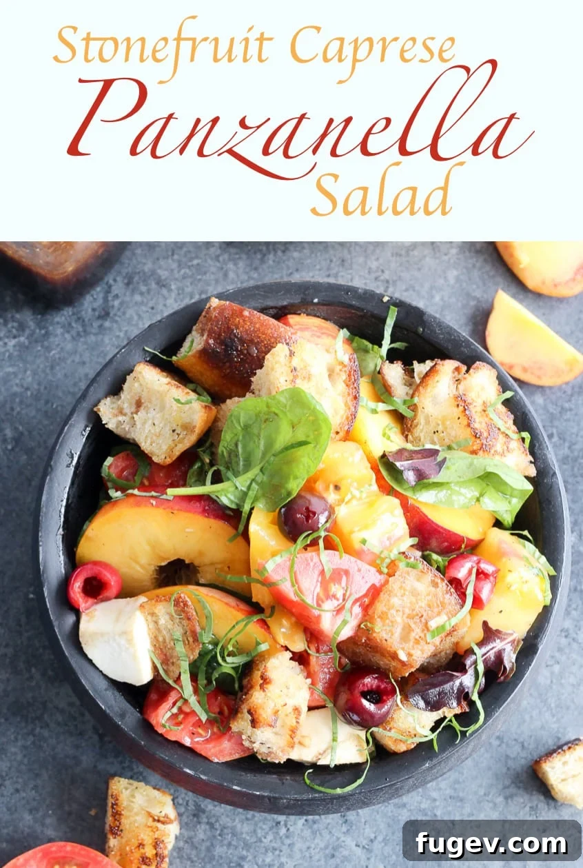 Orchard Fresh Caprese Panzanella 6 A beautifully arranged large wooden bowl filled with Stone Fruit Caprese Panzanella Salad, ready to be served at a summer gathering.