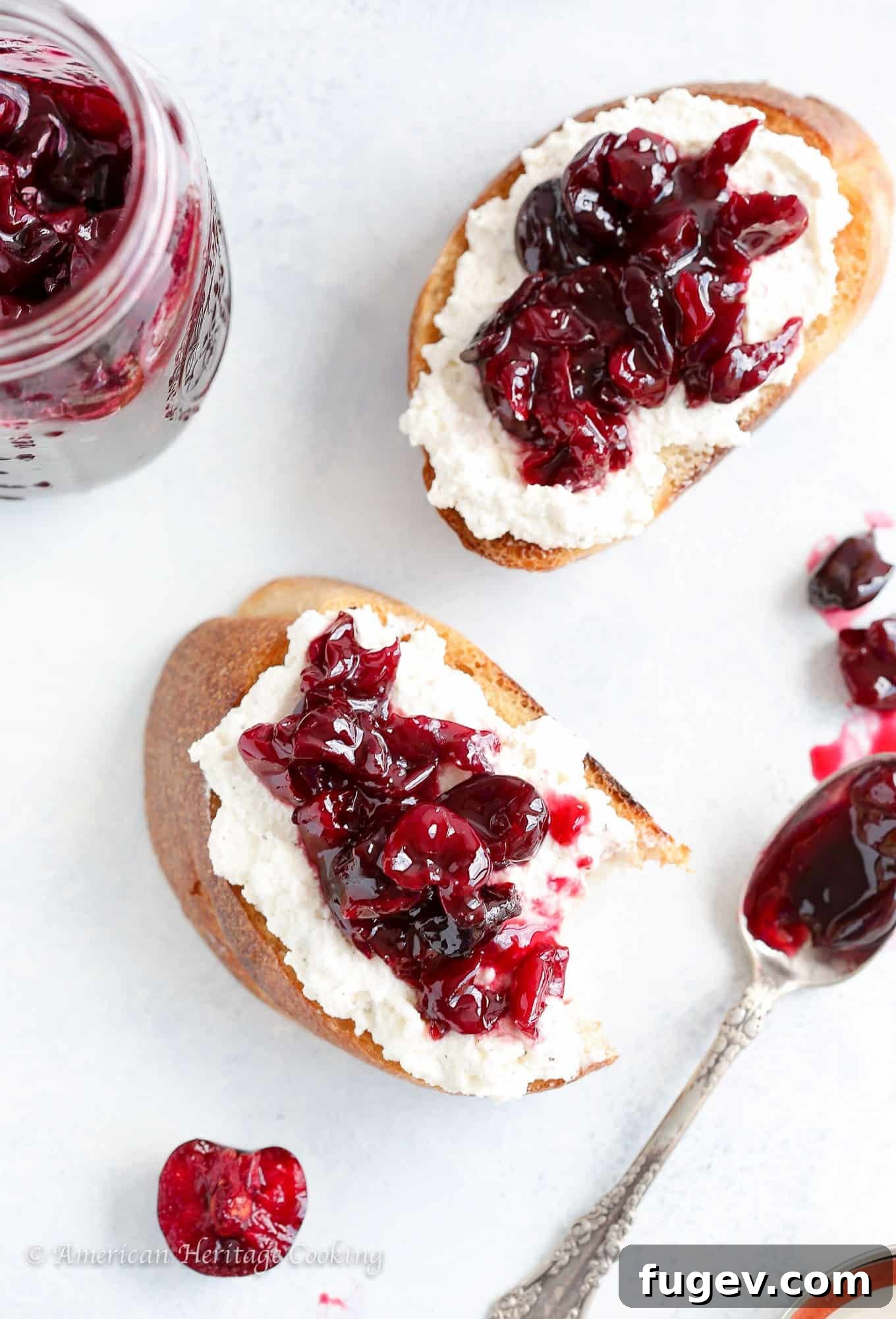 Simply Divine Cherry Jam 3 Close-up of black pepper honey ricotta toast topped with homemade cherry preserves, ready for an easy snack or breakfast. This quick and easy treat is perfect for enjoying summer's cherry flavors throughout the year.