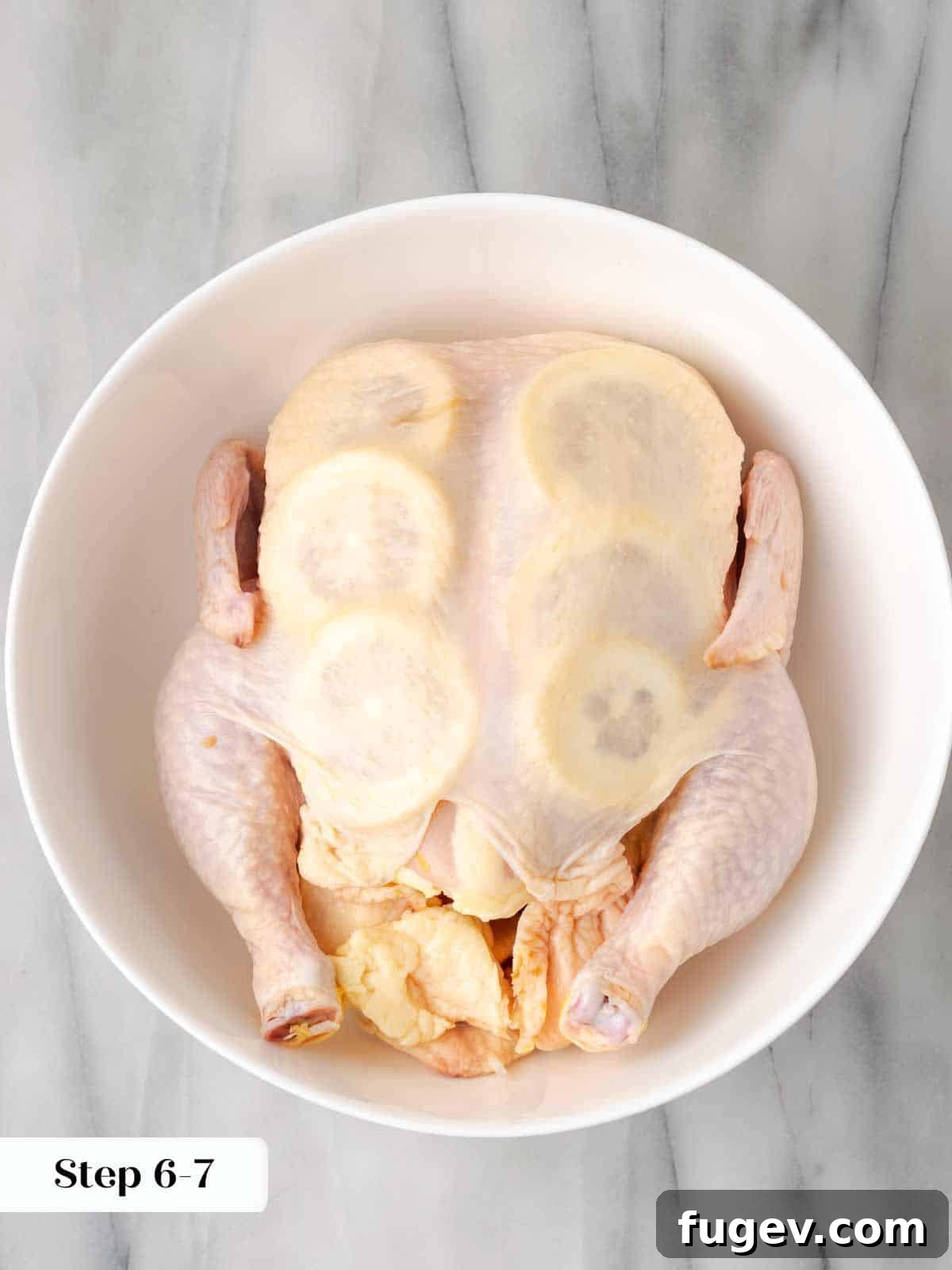 Zesty Lemon Roasted Chicken 6 lemon slices stuffed under chicken skin.