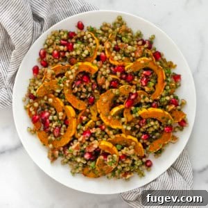 Caramelized Delicata Squash Couscous 7 A close-up of a serving of Roasted Delicata Squash Couscous on a plate.