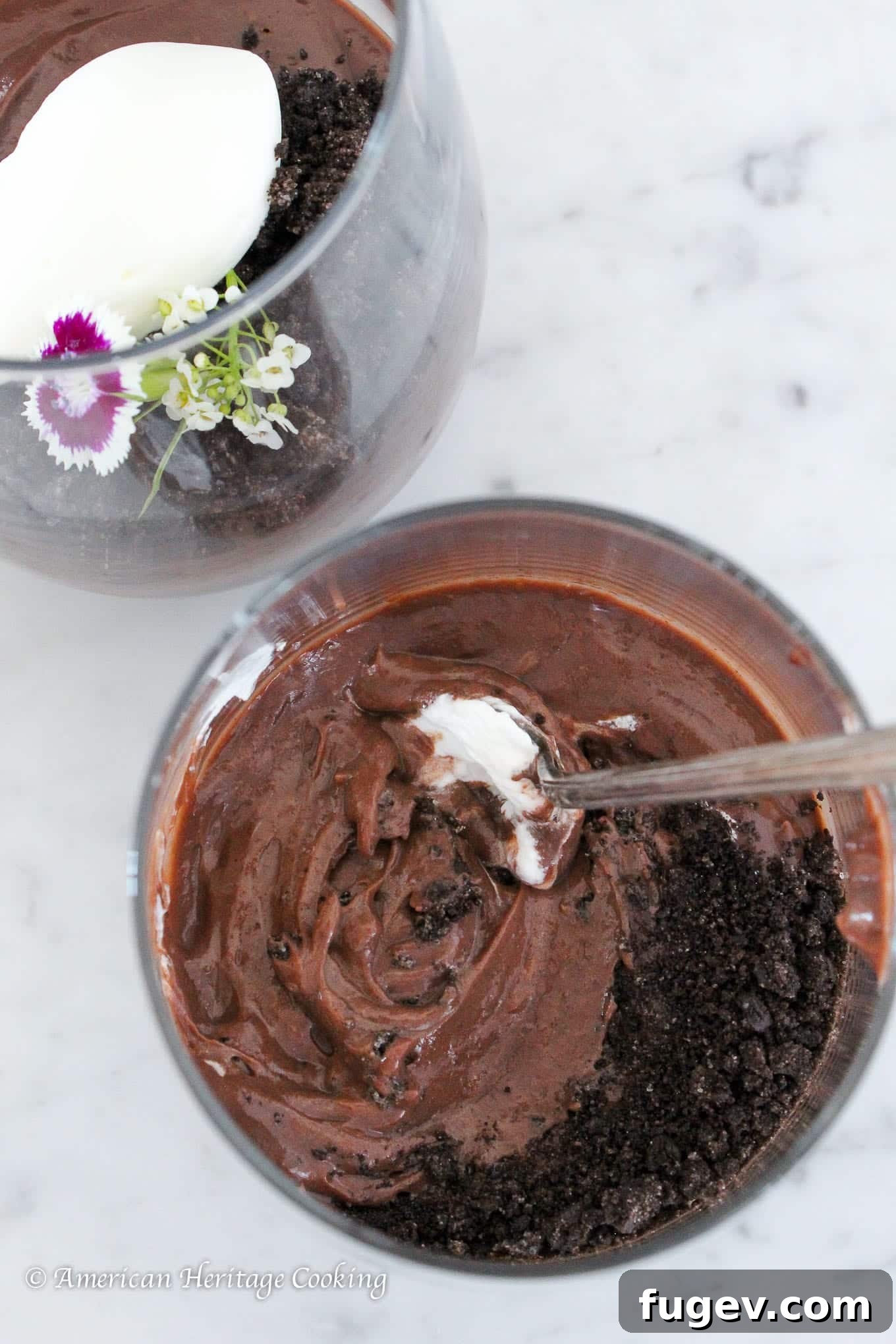 Decadent Homemade Chocolate Pudding 2 Exquisitely dark and creamy chocolate pudding in a clear glass cup, ready to be enjoyed.
