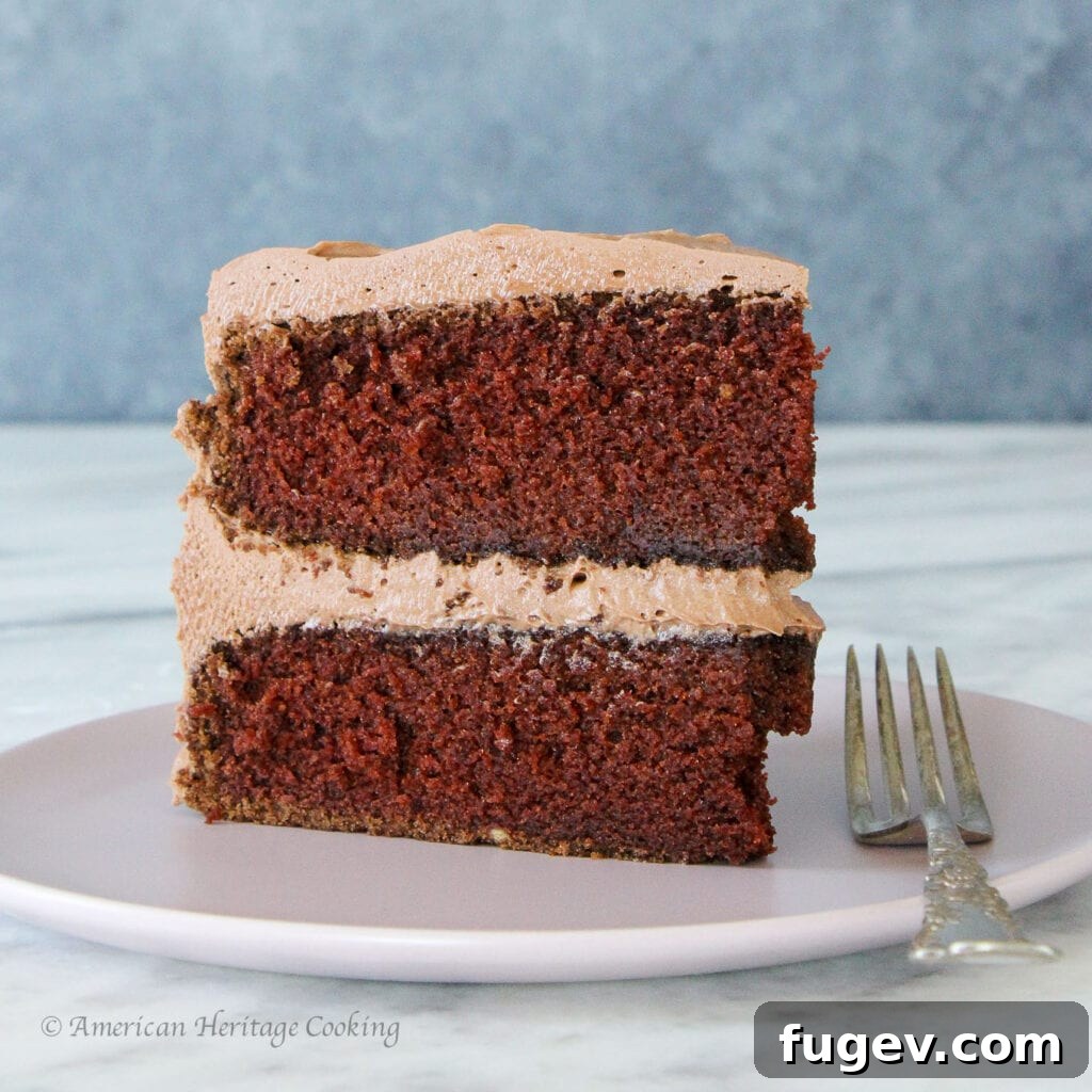 Velvet Chocolate Mayonnaise Cake 2 A beautifully sliced Chocolate Mayonnaise Cake, revealing its moist layers and silky chocolate cream cheese buttercream.