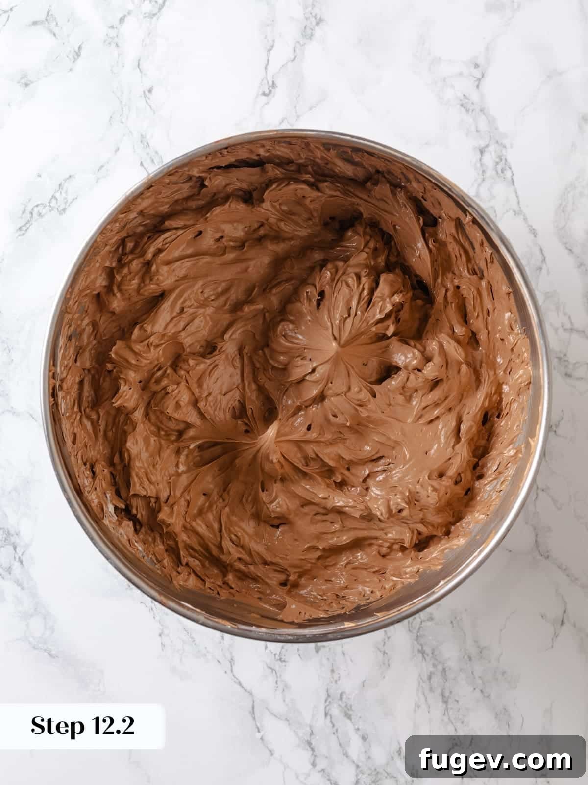 Sinfully Rich Chocolate Delight 21 Chocolate Swiss meringue buttercream after initial mixing with chocolate, showing it's almost smooth and just needs final whipping.