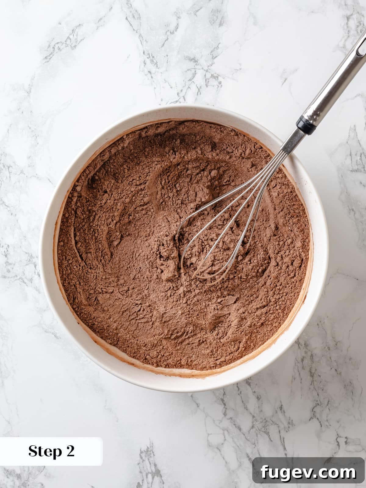 Sinfully Rich Chocolate Delight 6 Mixed dry ingredients including flour, cocoa powder, baking soda, and salt, waiting to be incorporated into the Devil’s food cake batter.