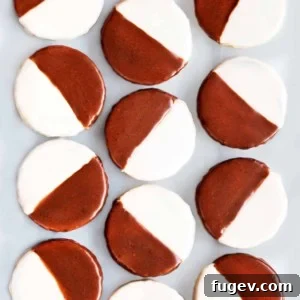 Bi-Color Bliss 2 Black and White Cookies, a New York delicacy, showcasing their half chocolate, half vanilla frosting.