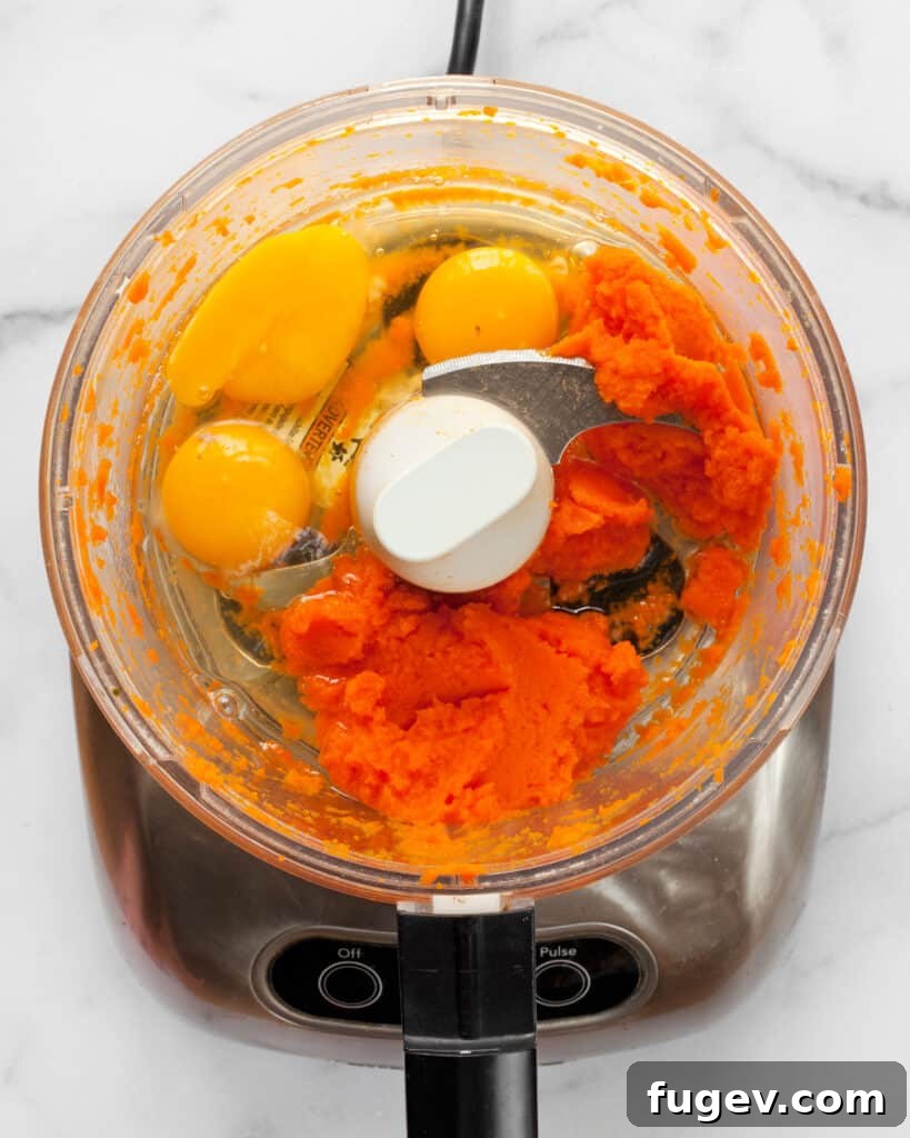 Vibrant Carrot Pasta 5 Carrot puree being prepared in a food processor, ready for pasta making.