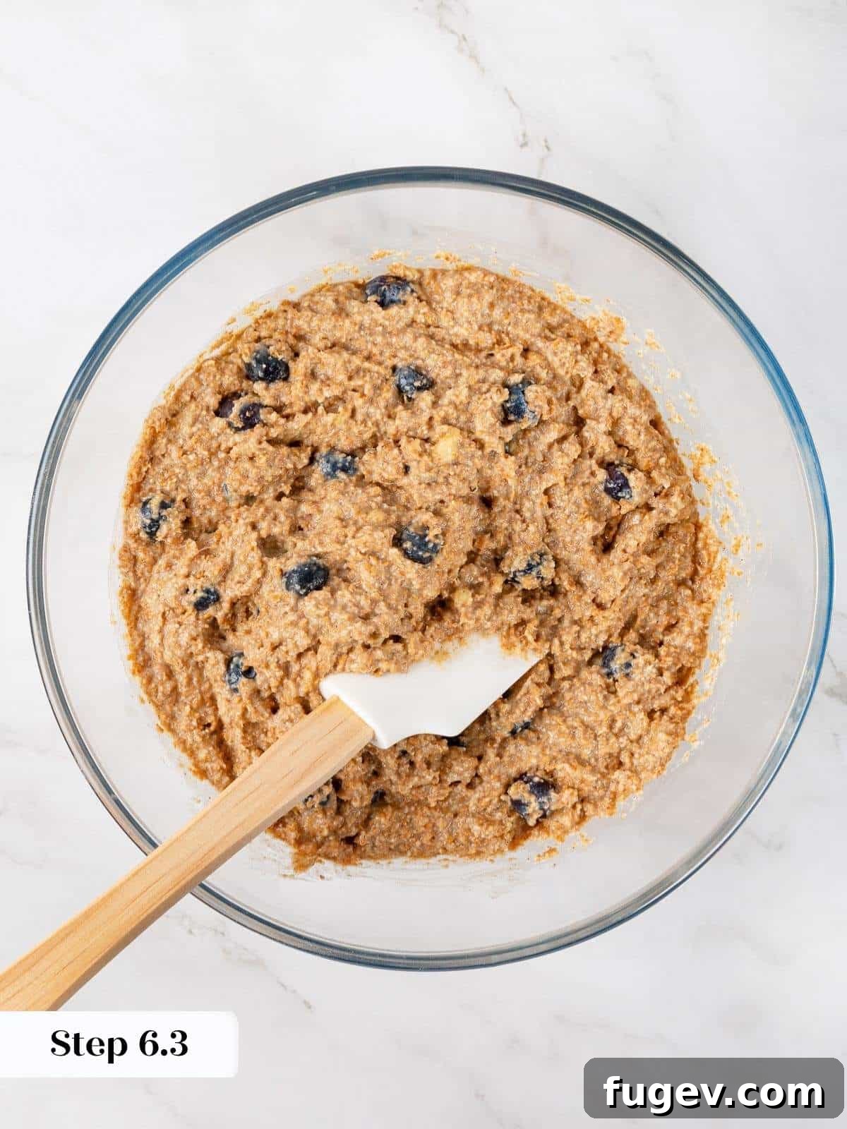 Power-Packed Banana Muffins 11 Thick, lumpy muffin batter with visible blueberries and bran, freshly mixed and ready to bake.