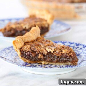 Bourbon Pecan Pie with a perfectly golden brown crust, showcasing its rich texture.