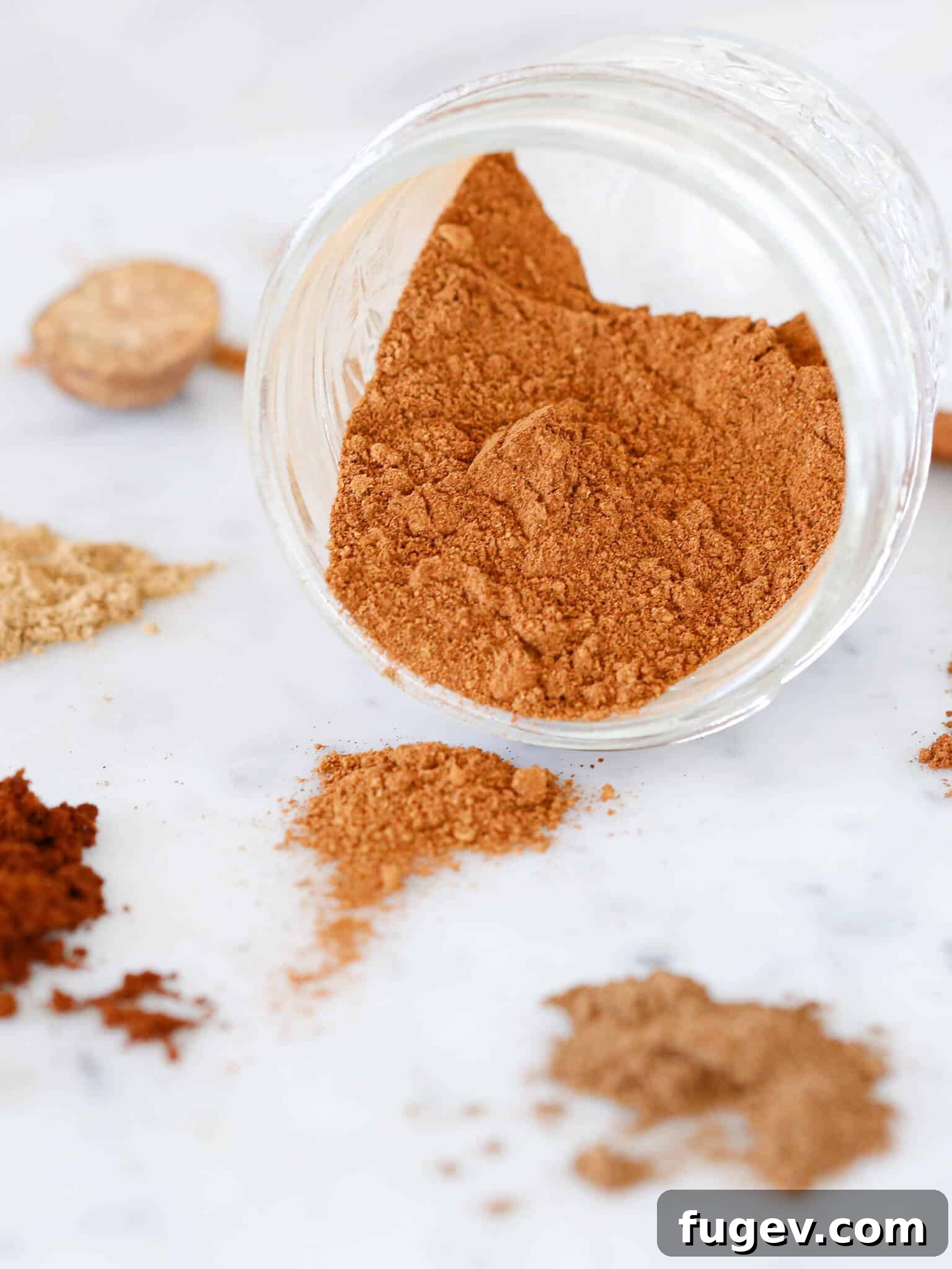 Homemade Pumpkin Spice Delight 2 Homemade pumpkin spice mix spilling out of a rustic jar, evoking autumn warmth.