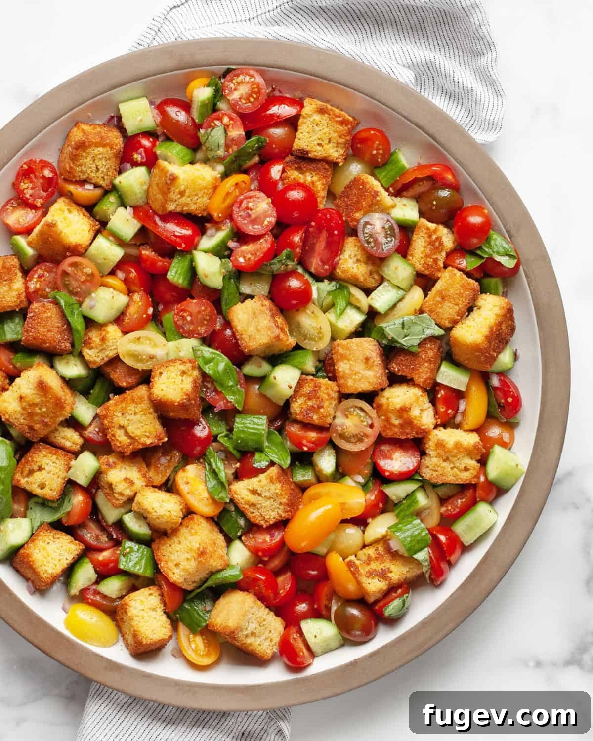 Rustic Cornbread Panzanella 7 A large platter of Cornbread Panzanella Salad, beautifully arranged for serving.