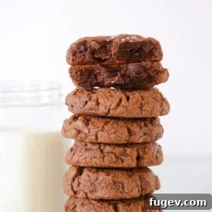 double Chocolate Chip Cookies Stacked next to milk.
