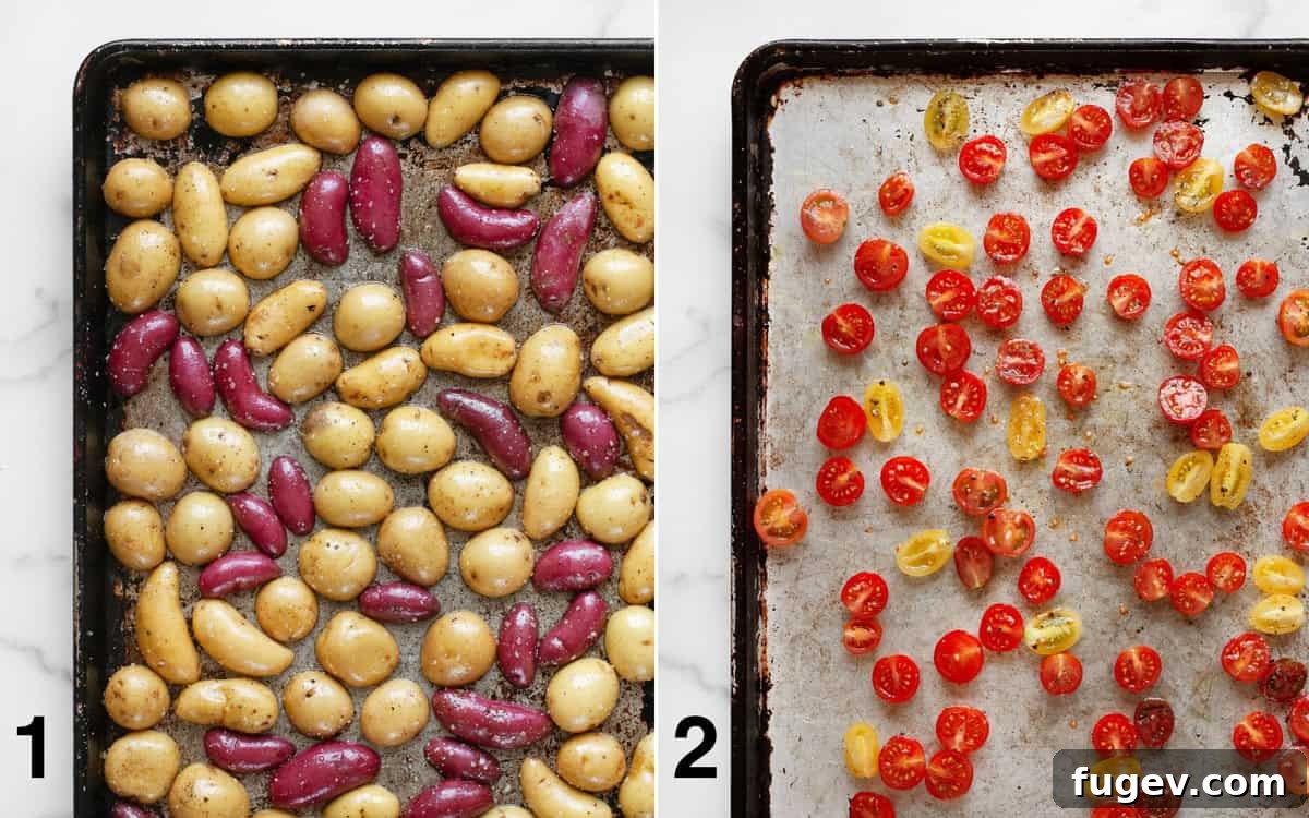 Mediterranean Roasted Tomato Pesto Potato Salad 4 Two separate sheet pans are shown. One contains seasoned fingerling potatoes arranged cut-side down, spaced evenly. The other has seasoned cherry tomatoes arranged cut-side up, also in a single layer, both prepped and ready for roasting.