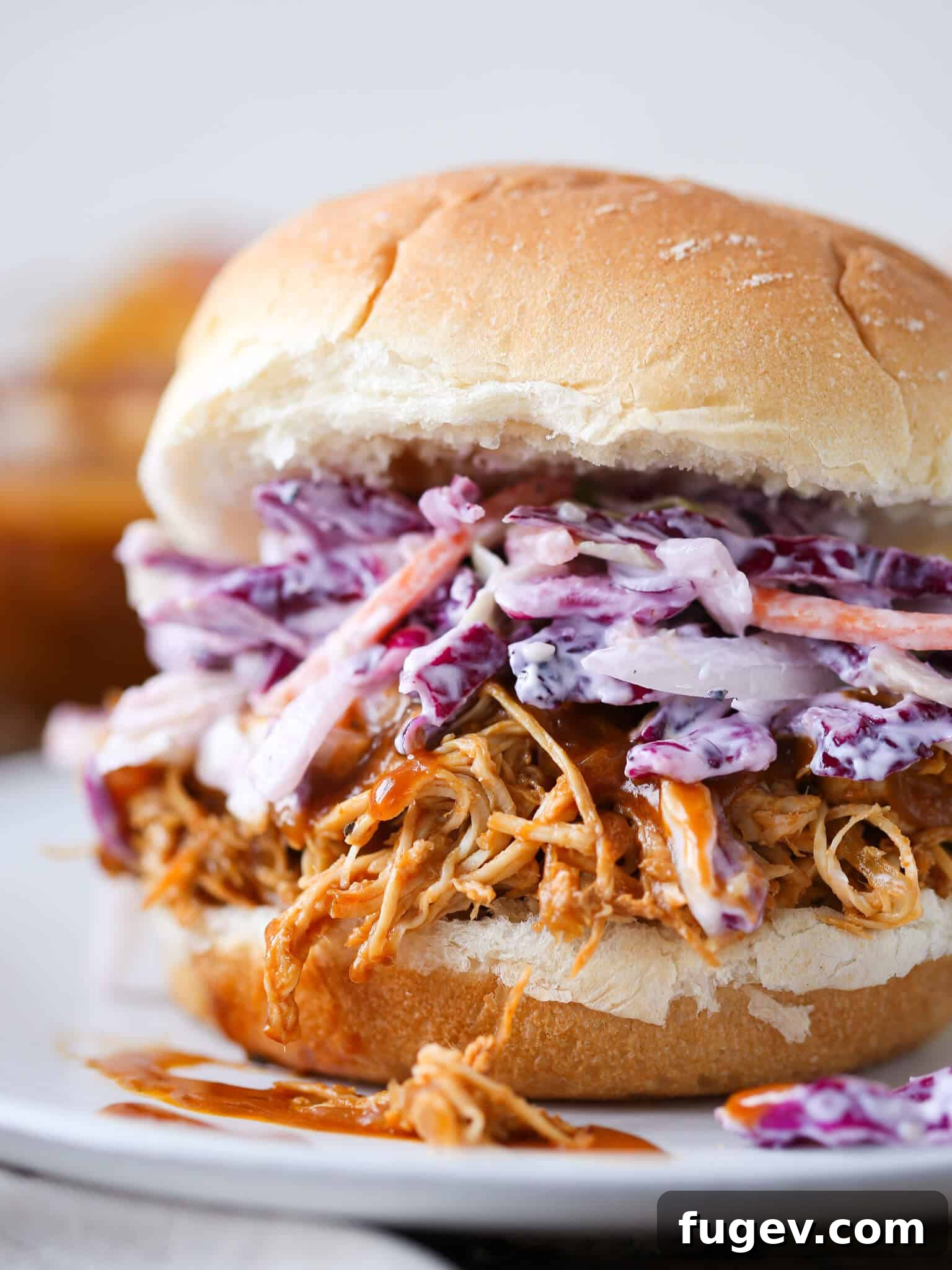 Fall-Apart Slow Cooker BBQ Pulled Chicken Sandwiches 2 Slow cooker barbecue pulled chicken in a bowl, ready to be served