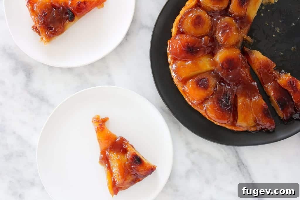 Caramelized Apple Upside Down Tart 2 Exquisitely baked Apple Tarte Tatin, showcasing deeply caramelized apples and a perfectly golden, flaky puff pastry crust.