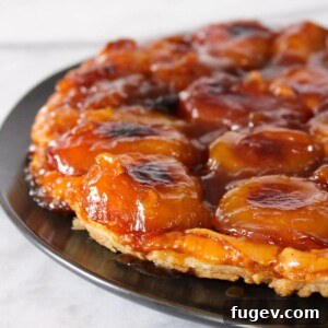 Caramelized Apple Upside Down Tart 4 Apple Tarte Tatin on black plate.