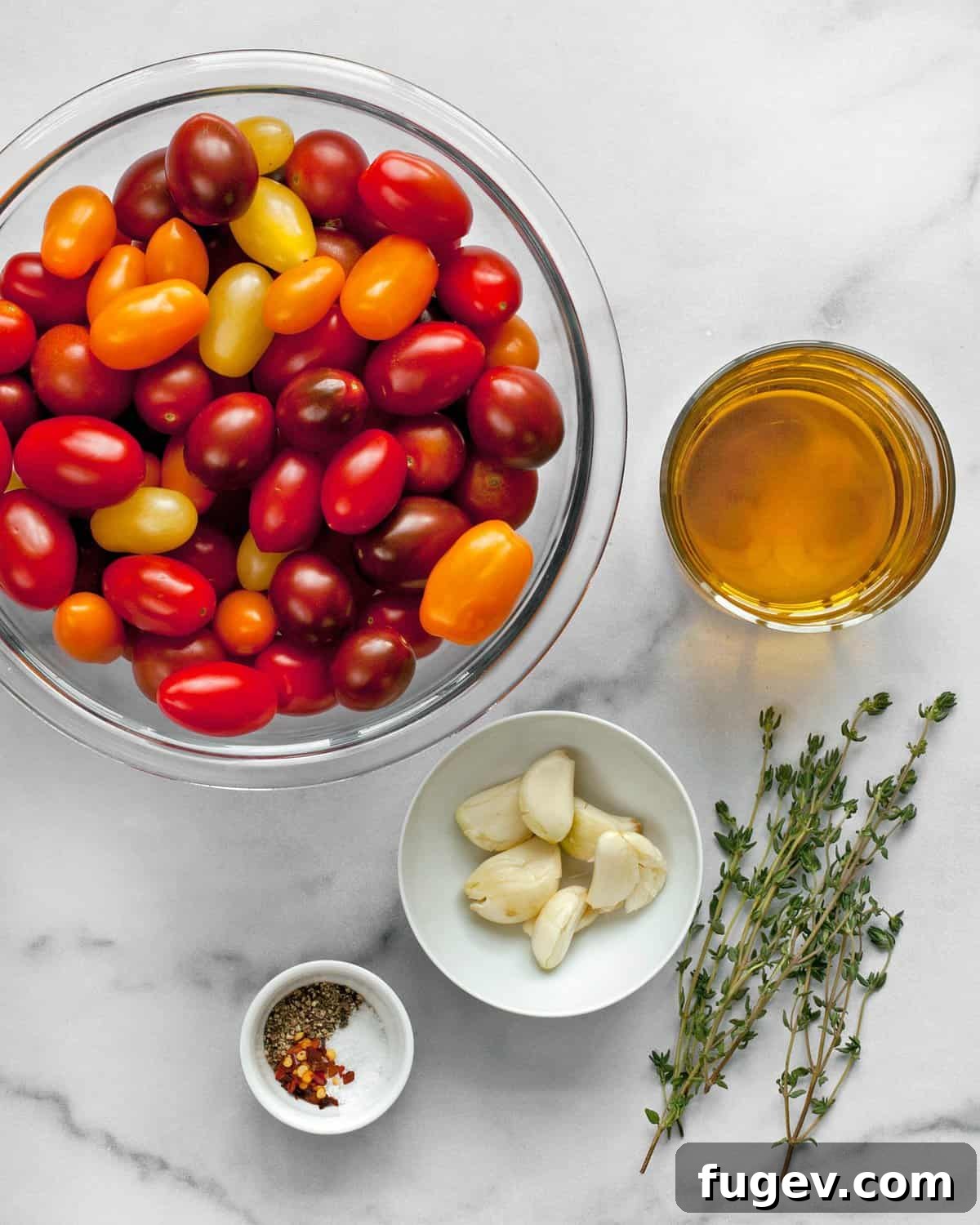 Slow-Roasted Cherry Tomato Jewels 3 Ingredients for cherry tomato confit: fresh tomatoes, garlic cloves, olive oil, thyme sprigs, salt, and pepper.