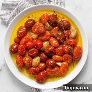 Cherry tomato confit on a plate.