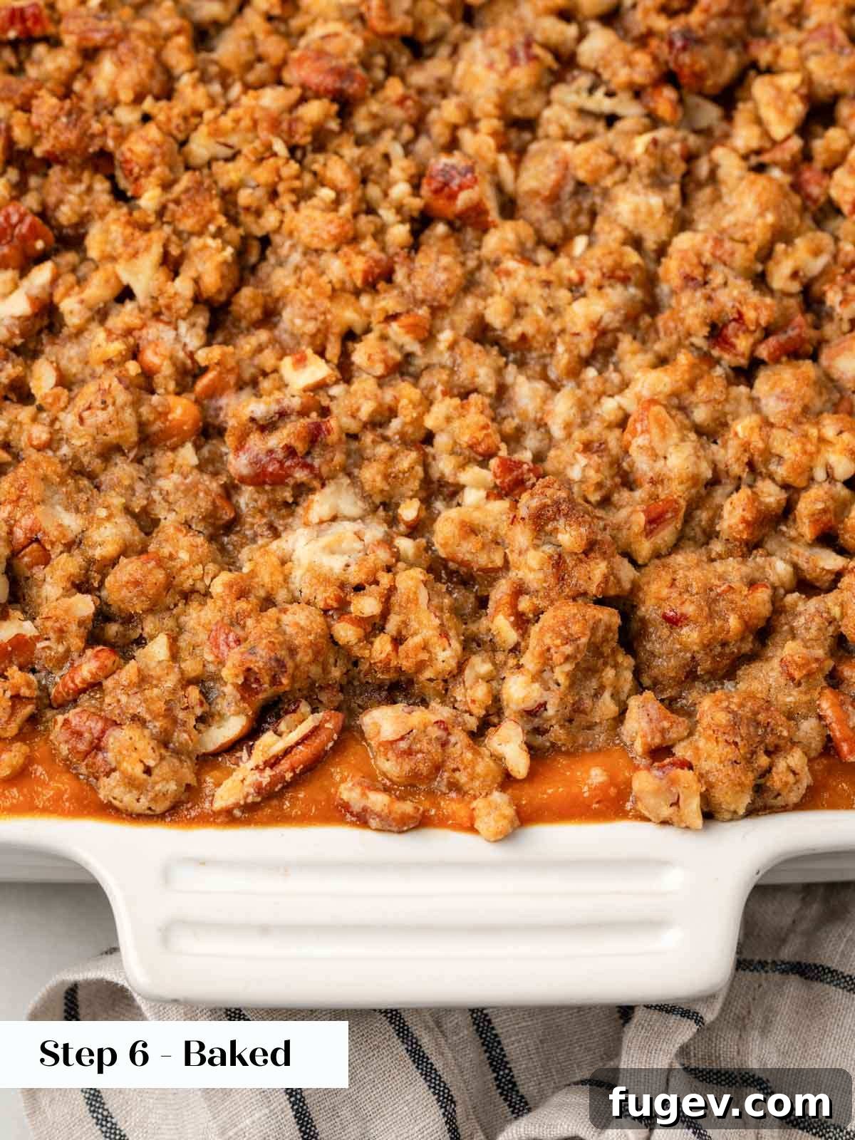 Golden Pecan Sweet Potato Bake 11 A golden-brown baked sweet potato casserole with a perfectly crisp pecan crumble topping, fresh from the oven.