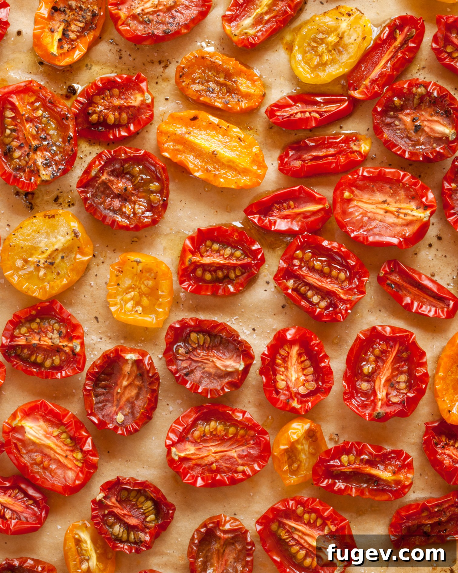 Golden Slow-Roasted Tomatoes 3 A close-up view of vibrant slow-roasted cherry tomatoes, showing their slightly wrinkled skin and rich color.