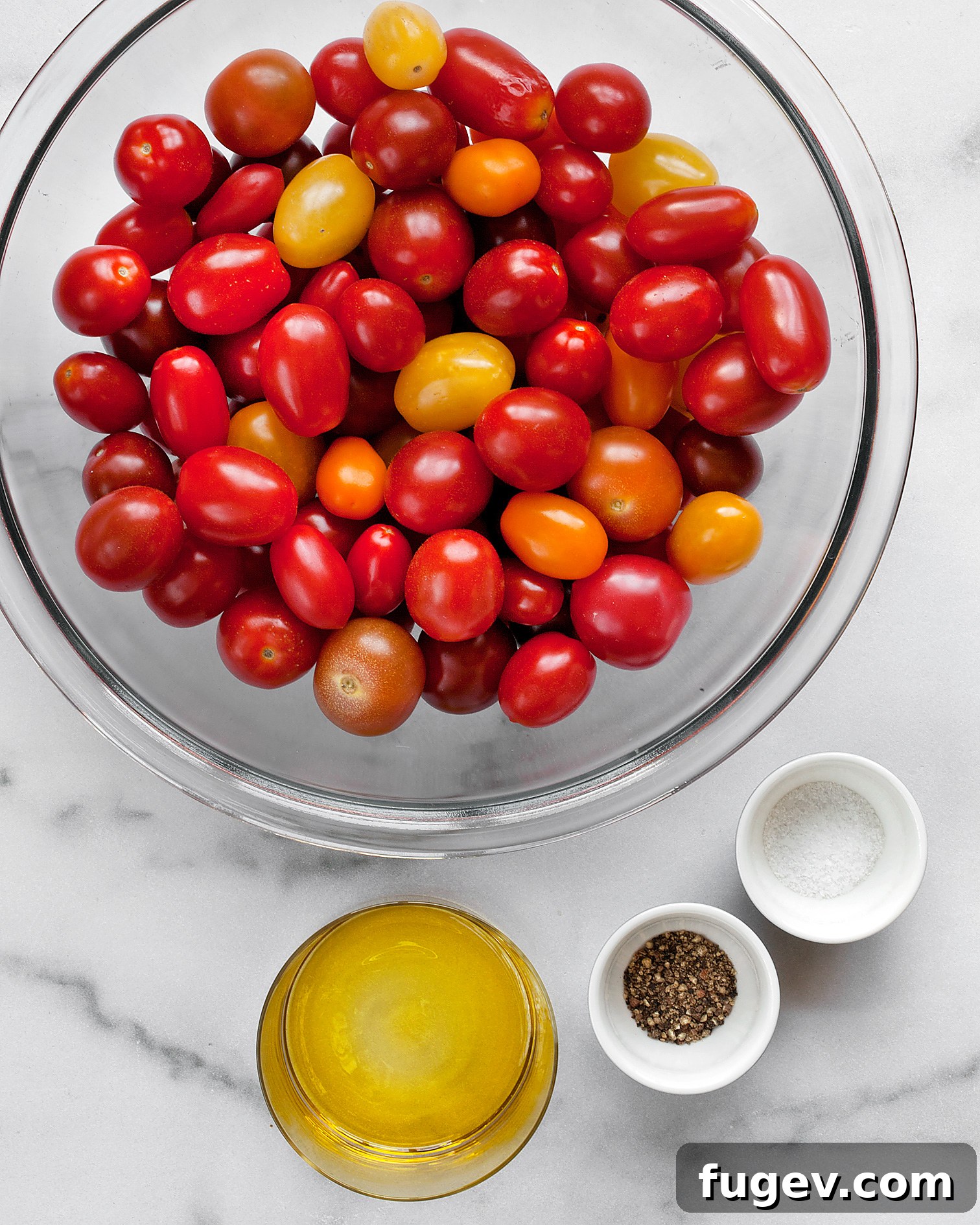 Golden Slow-Roasted Tomatoes 4 Key ingredients for slow-roasted tomatoes: fresh tomatoes, olive oil, salt, and pepper arranged on a surface.