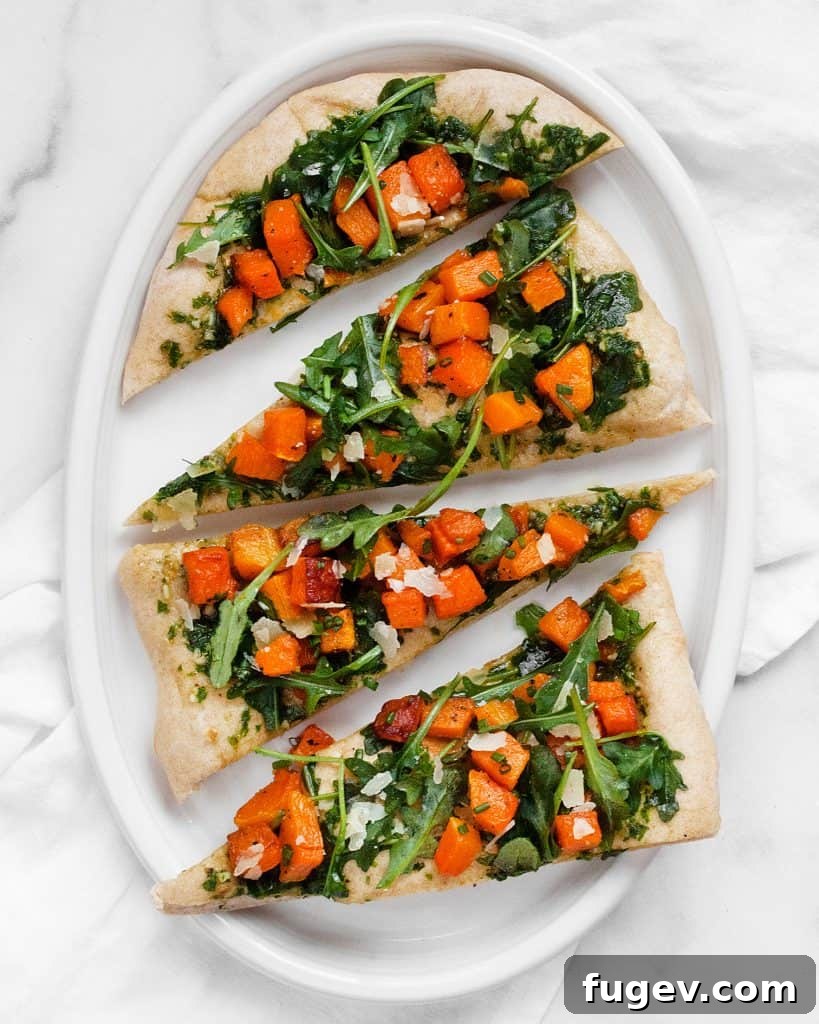Caramelized Butternut Pizza 5 Uncut roasted butternut squash pizza ready to be served.