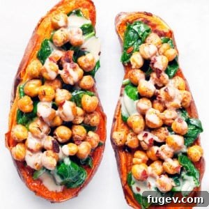 Baked sweet potatoes stuffed with crispy chickpeas and spinach.