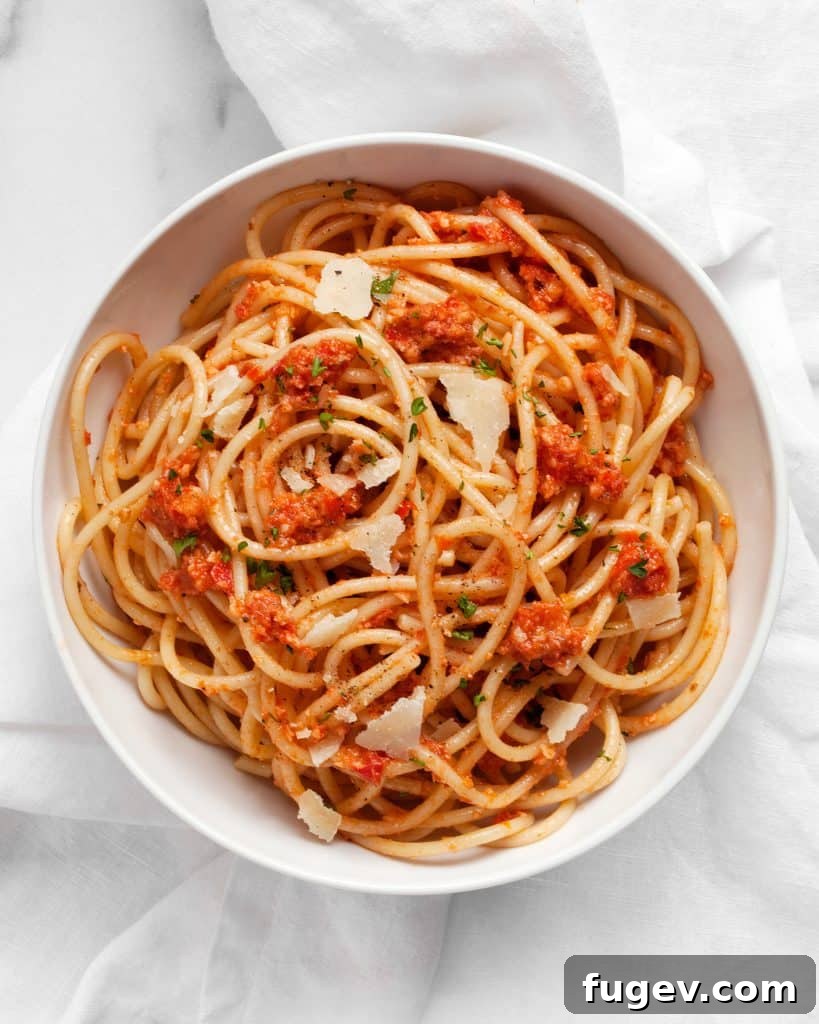 Slow Roasted Tomato Pesto 3 A young child enjoying pasta with Roasted Tomato Pesto