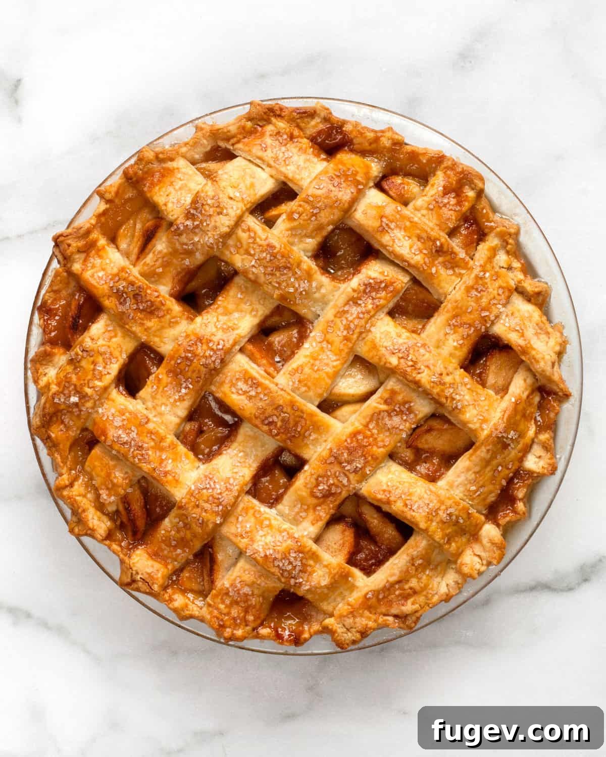 Salted Caramel Apple Crumble Pie 14 A beautifully baked lattice top salted caramel apple pie, fresh from the oven, cooling slightly.