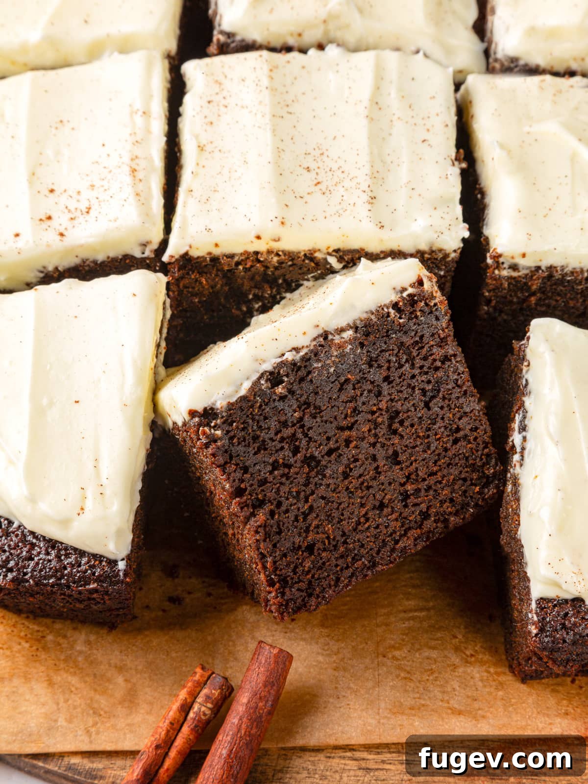 Warm Spiced Gingerbread 14 Several gingerbread cake pieces with cinnamon sticks reinforcing the cozy holiday flavor profile.