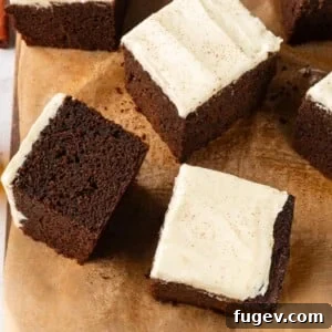 Multiple gingerbread cake slices arranged casually to highlight soft crumb and deep color.