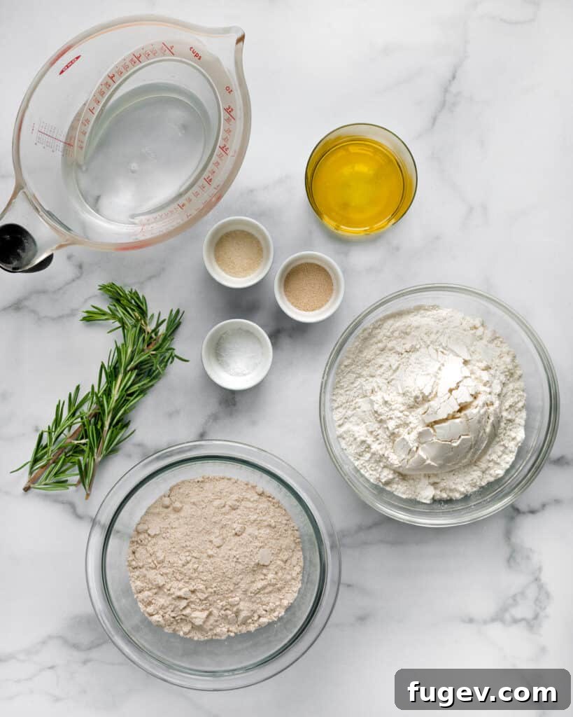 Fragrant Rosemary Fougasse 3 A selection of fougasse ingredients including fresh rosemary, bread flour, whole wheat flour, yeast, and sea salt.