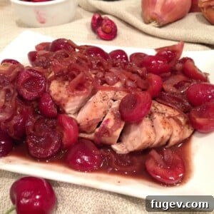Plated Chicken in Cherry Wine Sauce with fresh garnishes