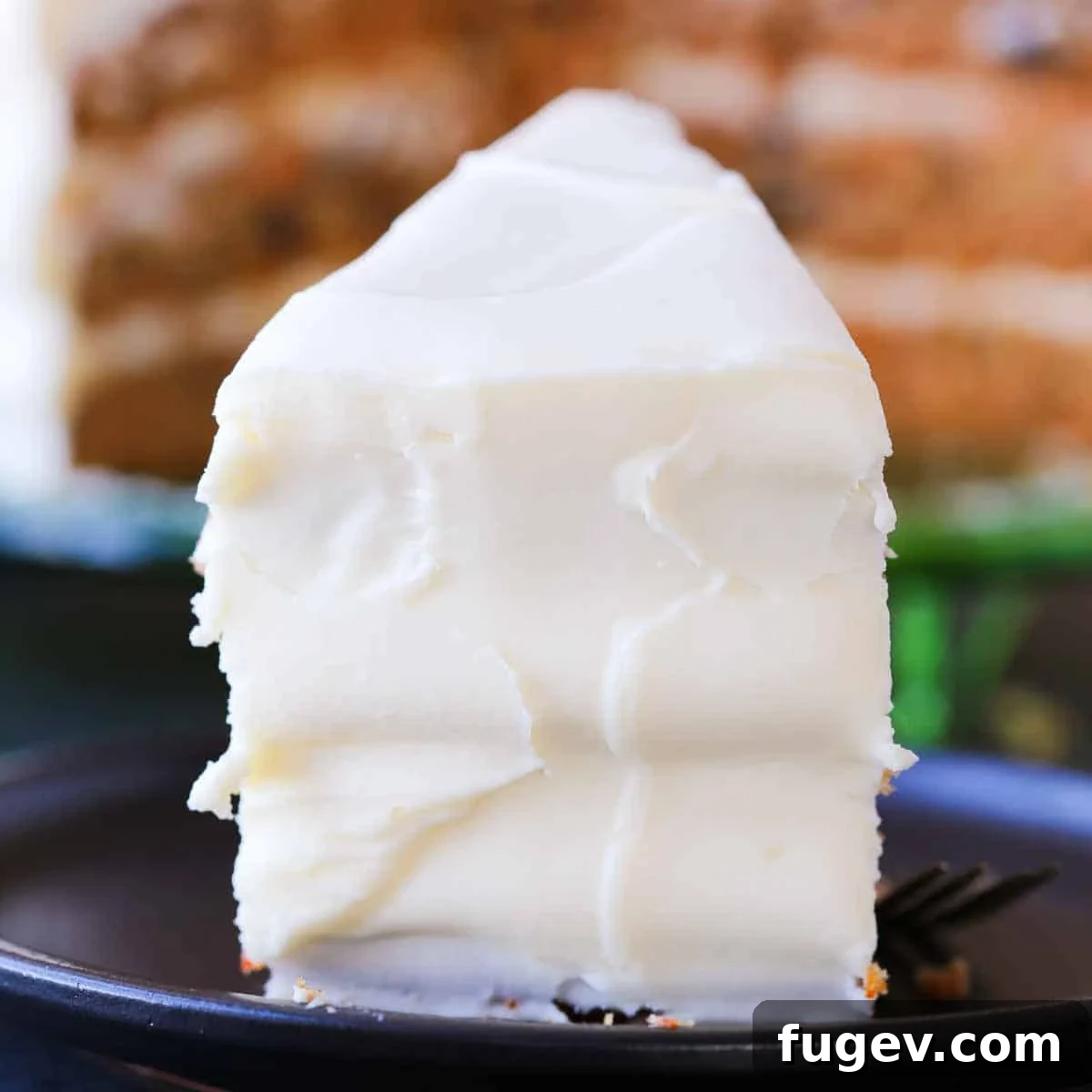 Lush Cream Cheese Buttercream 9 A slice of easy carrot cake adorned with a generous layer of cream cheese frosting.