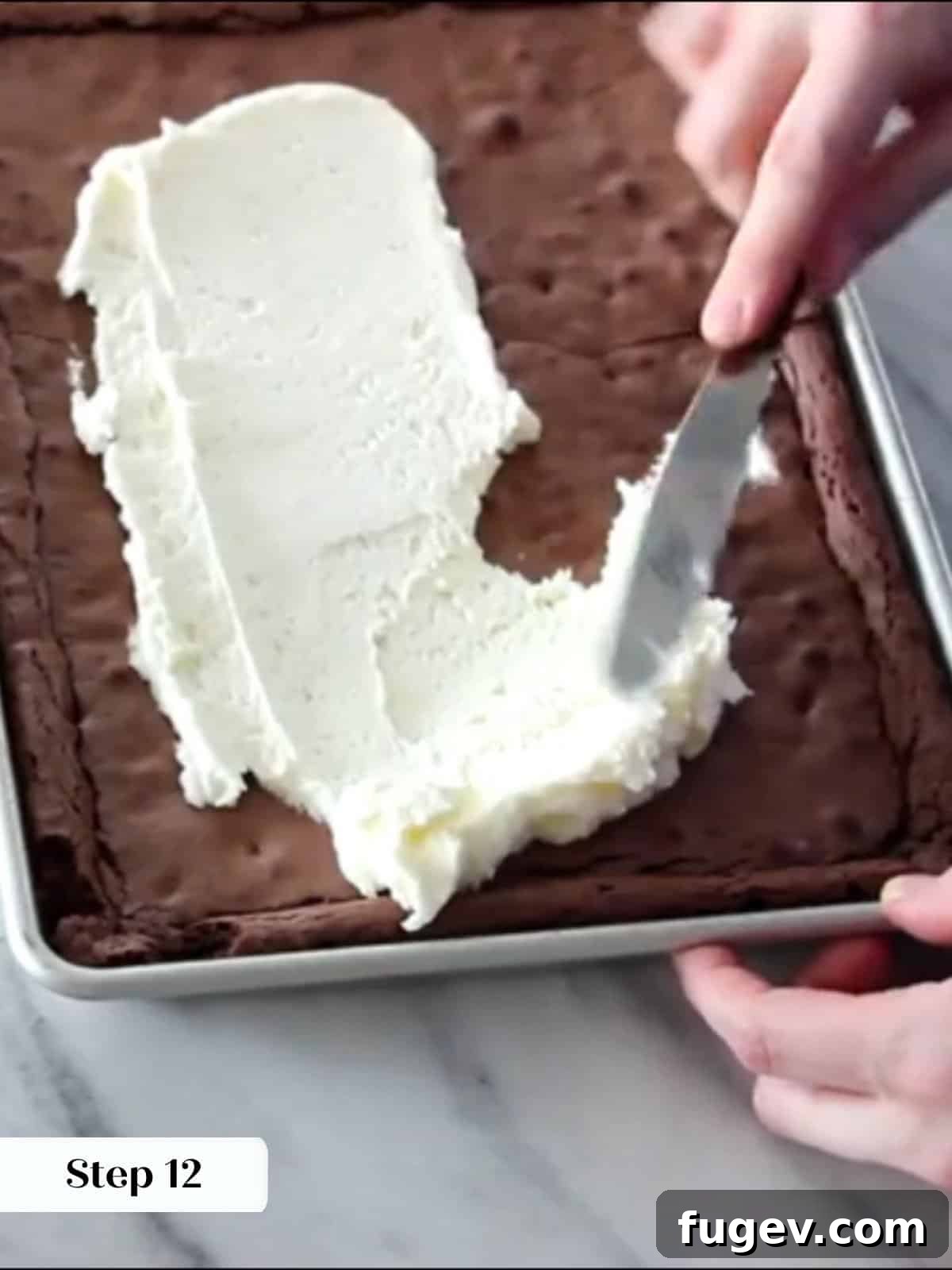 Peppermint Fudge Brownies 18 Peppermint frosting expertly applied evenly across the surface of cooled brownies, creating a smooth and festive topping.
