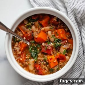 Sweet potato white bean quinoa soup in a pot.