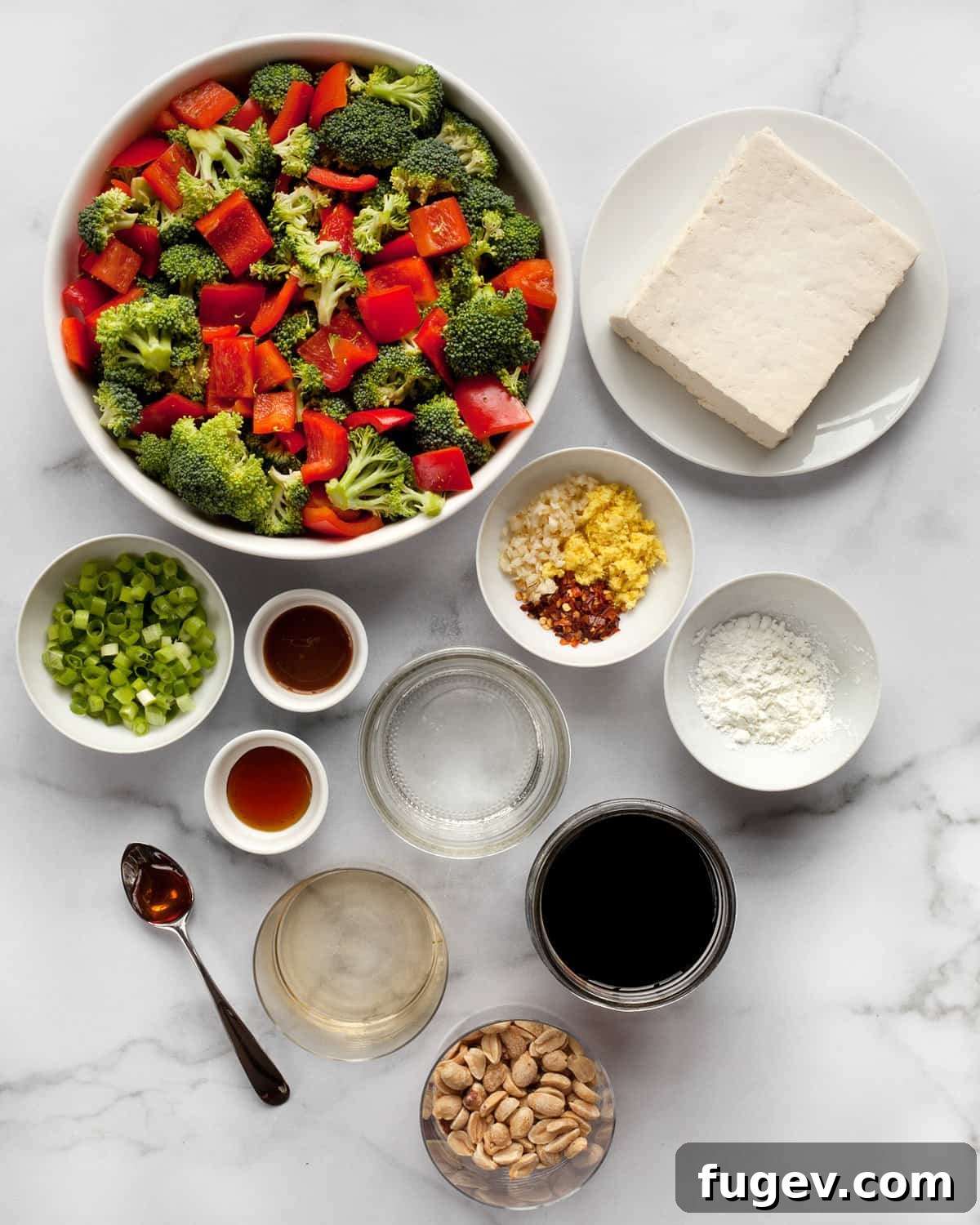 Spicy Kung Pao Tofu 3 Ingredients for Kung Pao Tofu including broccoli, peppers, tofu, peanuts, scallions, ginger, garlic, red pepper flakes, hoisin, sesame oil, rice vinegar, and cornstarch.