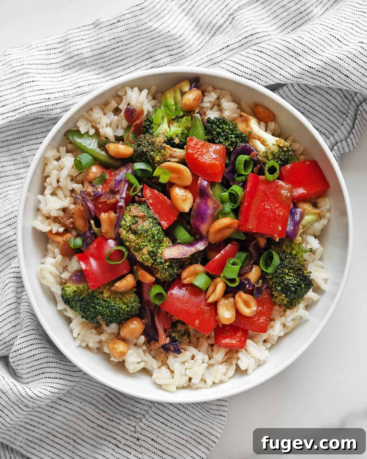 Nutty Vegetable Stir-Fry 7 A beautiful bowl of easy veggie stir-fry served with a side of brown rice, ready to be enjoyed.