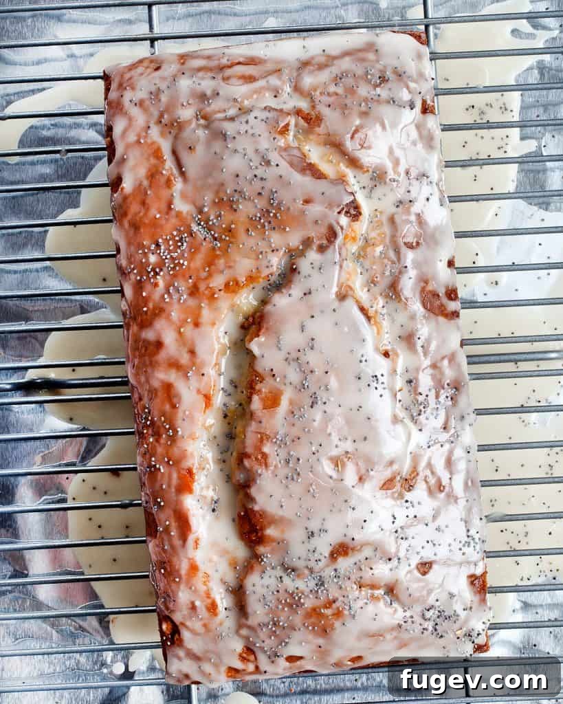 Zesty Grapefruit Poppy Seed Loaf 4 Grapefruit Poppy Seed Loaf Cake cooling on a wire rack.