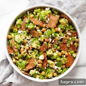 Avocado chickpea salad in a serving bowl, ready to be enjoyed with its vibrant colors and textures.
