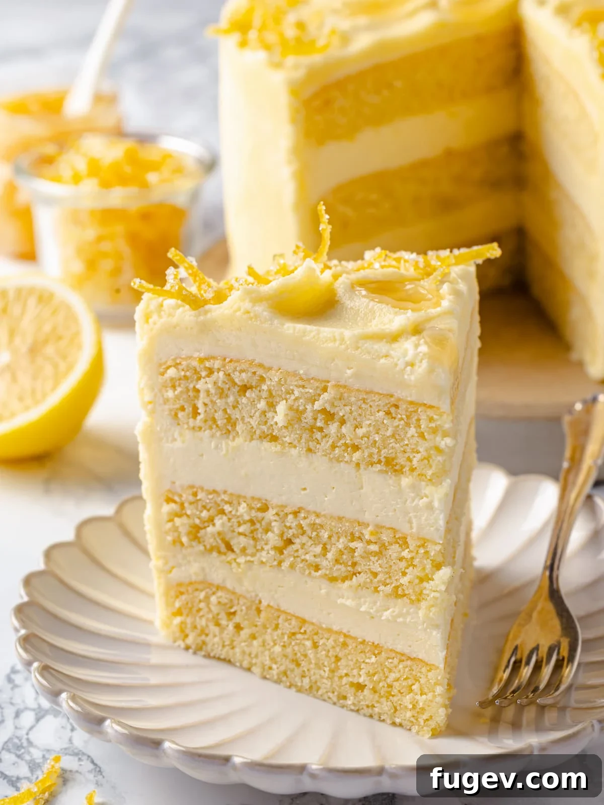 Dreamy Lemon Cloud Frosting 13 Slice of layered lemon cake showing thick layers of lemon Swiss meringue buttercream.