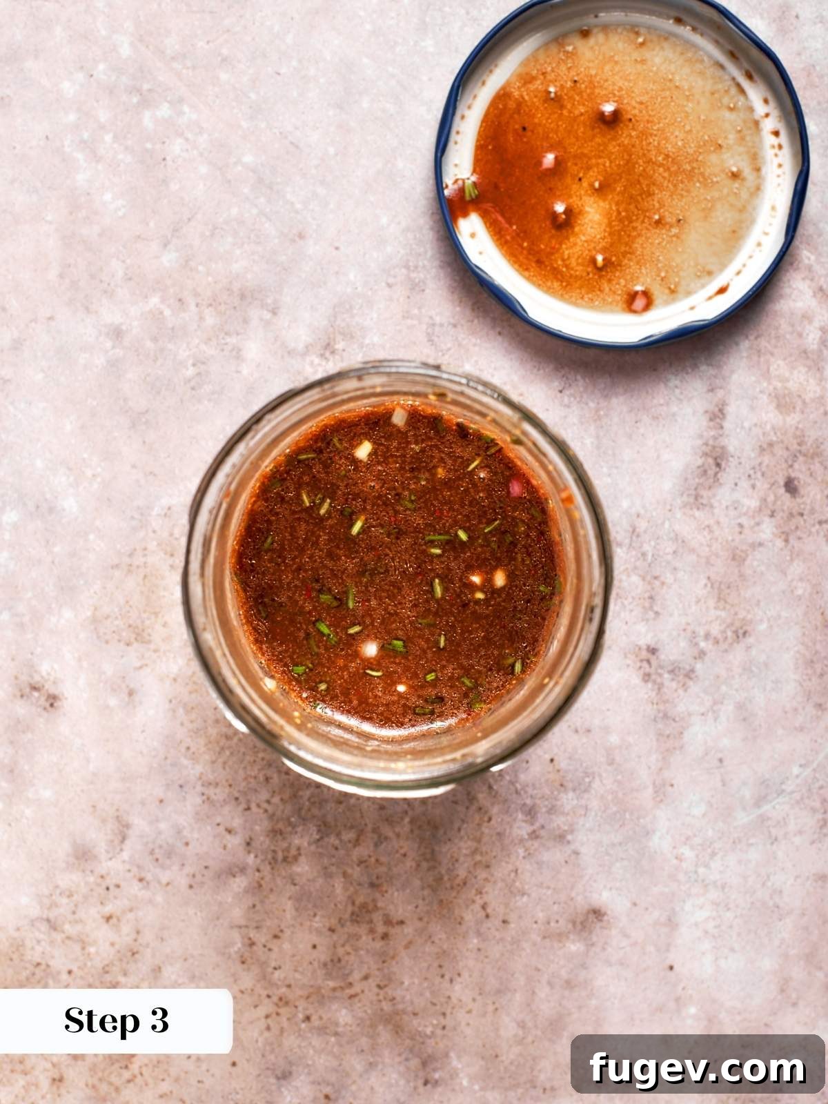 Fresh vinaigrette ingredients vigorously blended in a mason jar until fully emulsified, showcasing a glossy and slightly thickened consistency.