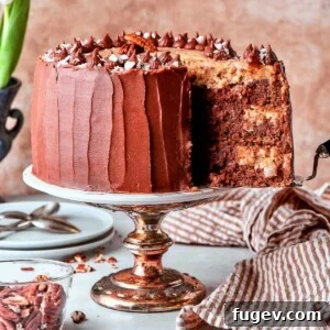 Cake server lifting slice of German chocolate cake from layered dessert, showing off the perfectly constructed layers.